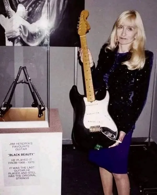 Monika Dannemann holding the black Stratocaster known as Black Beauty.